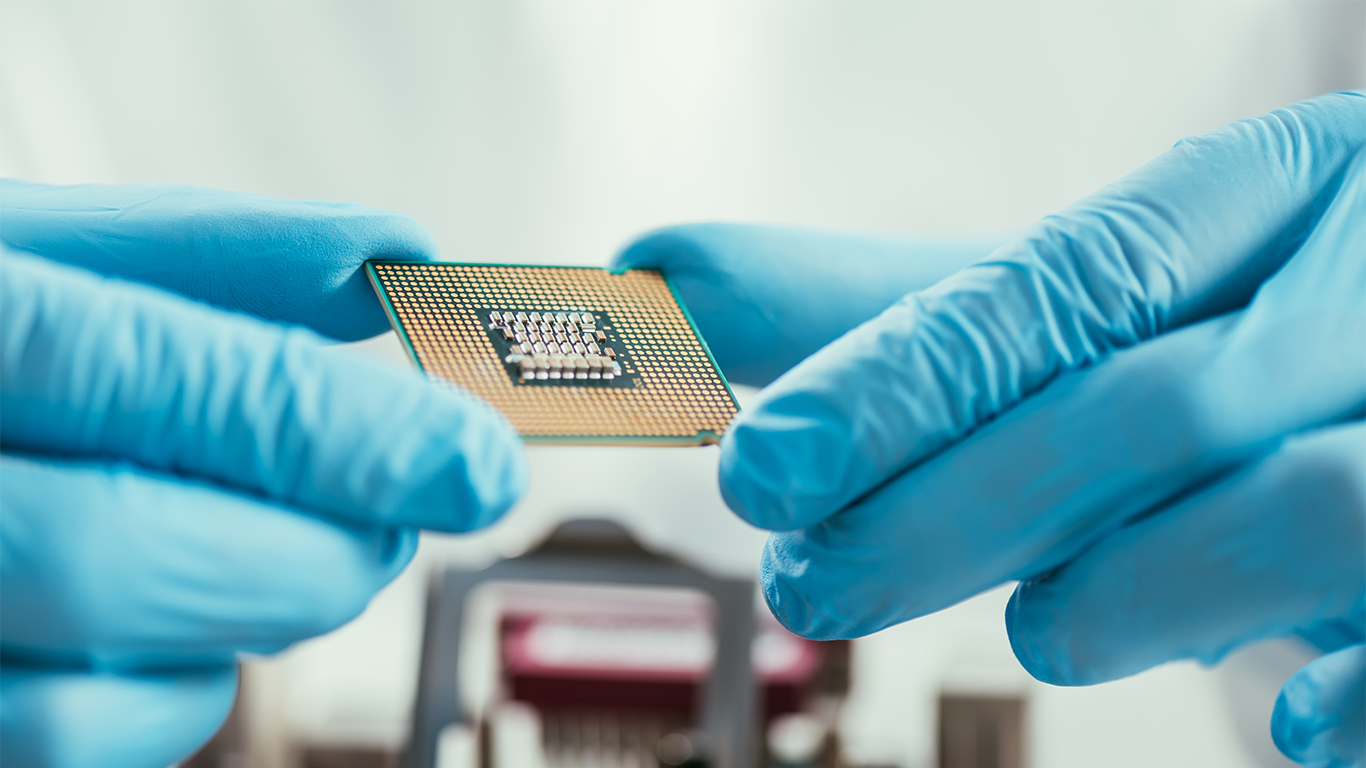 Worker holding semiconductor wafer