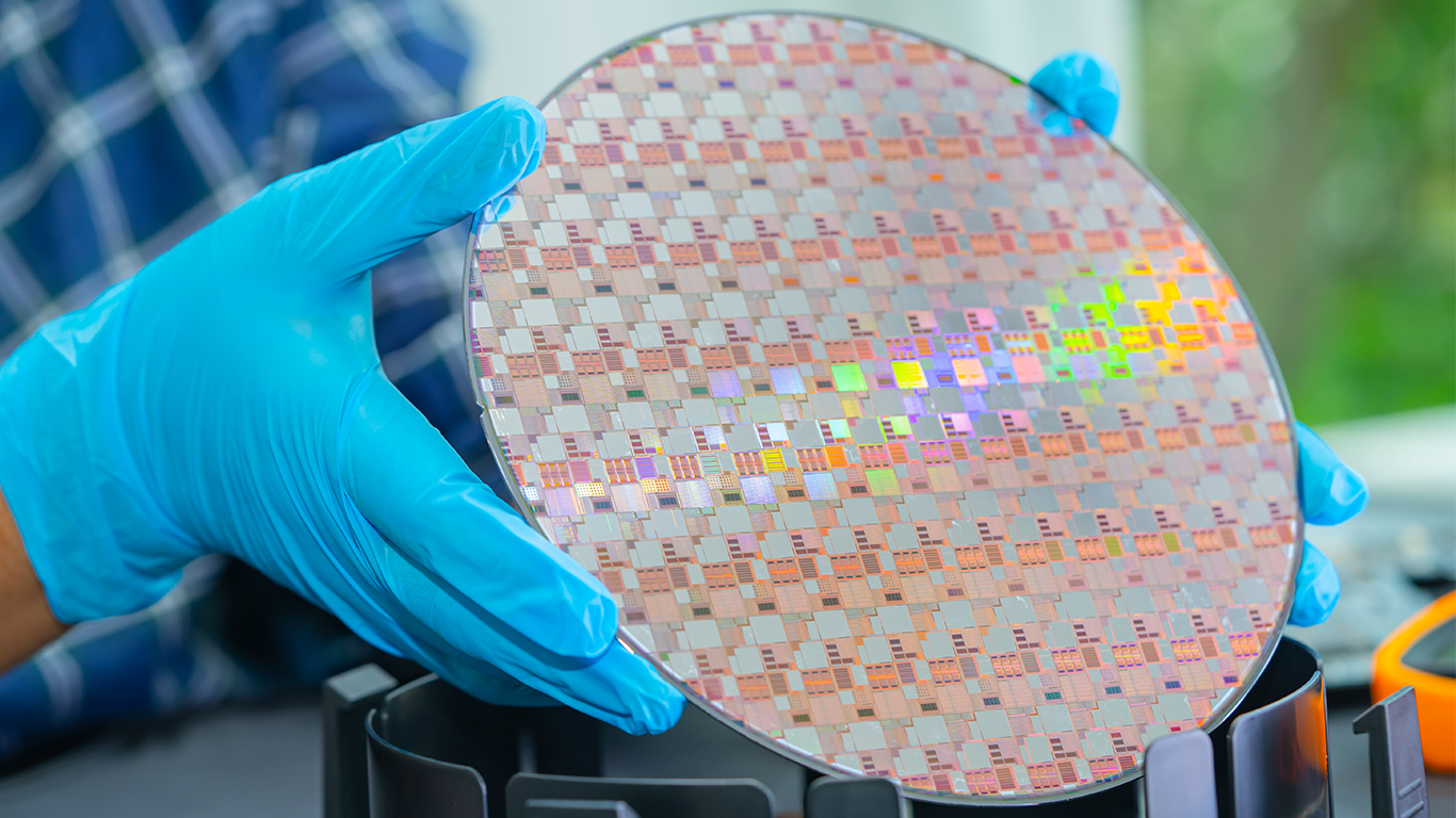 Worker holding semiconductor wafer