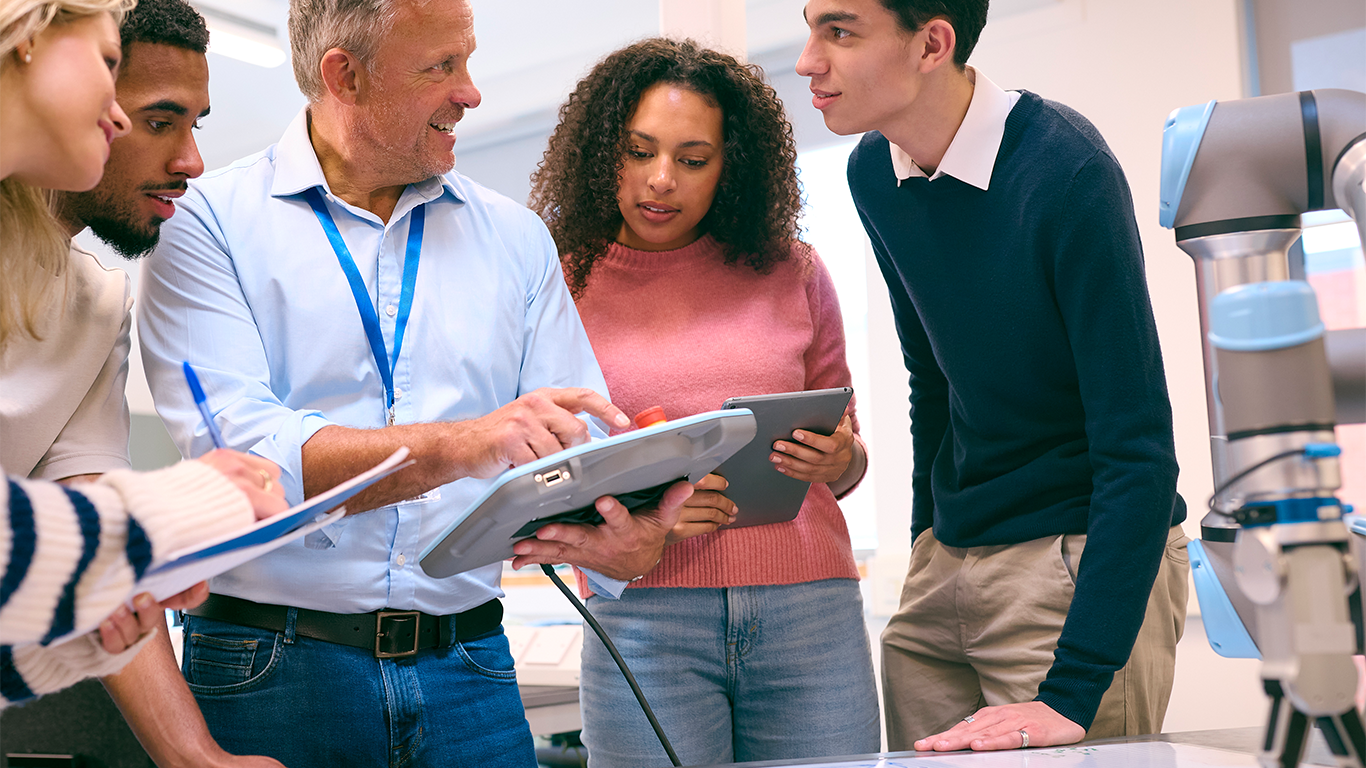 College students gathered around instructor
